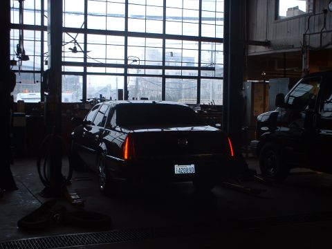 1999 Ford Crown Victoria - Seattle Police maintanence garage. Govoner's new Cadilac.
