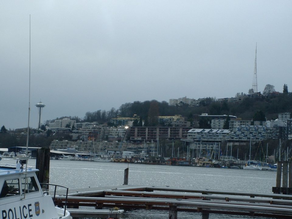Police boat in foreground, Seattle skyline with Space Needle in background