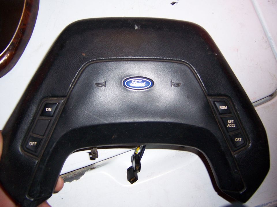Ford steering wheel center pad with cruise control buttons and blue oval emblem