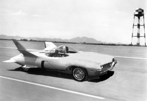2002 Ford Crown Victoria - This experimental jet car appears to be on a test track with a water tower nearby.