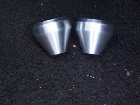 1988 Suzuki Samurai - Two brushed aluminum cones are shown resting on a dark, carpeted surface. The registry label indicates a 1988 Suzuki Samurai, but this phot…