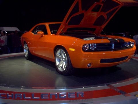 1970 Ford Ranchero - This orange Dodge Challenger concept car is displayed with its hood open, revealing the engine bay.