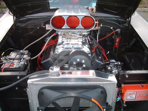 1994 Ford Bronco - Custom engine bay features a prominent supercharger and updated ignition system.