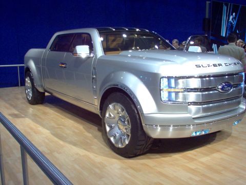 1970 Ford Ranchero - The Ford Super Chief concept truck is shown in a 3/4 front view at an auto show.