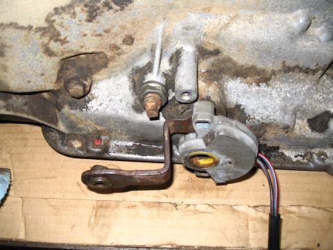 1984 Ford Bronco - Neutral safety switch assembly on a vehicle transmission housing.