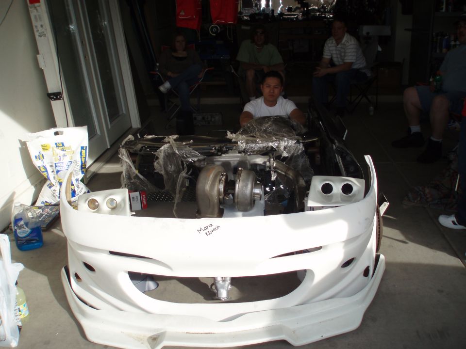 Pretty car... that's a aftermarket probe bumper, projectors, intake manifold, turbo, dash, side skirts, exhaust, sub, and amp... complete with driver and steering wheel
