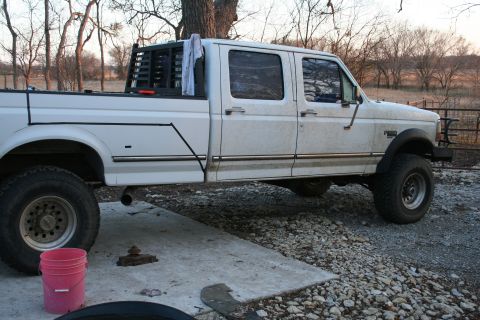 1993 Ford F-350 - The little black line of tape thats just kinda on there is the center for the new axle location, but 3ft lower. Cut along the black line...