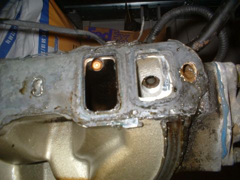 1993 Ford Bronco - Engine intake manifold part, showing gasket mating surface and bolt holes.