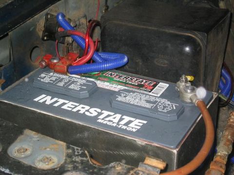 1986 Ford Bronco - Original battery with about 10 wires coming out of it.