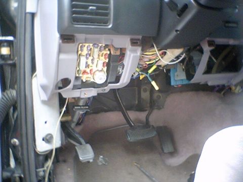1994 Ford Bronco - The interior fuse panel and associated wiring are exposed, showing a complex network of connections.