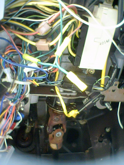 1994 Ford Bronco - A complex tangle of wires and connectors is visible within the vehicle's interior.