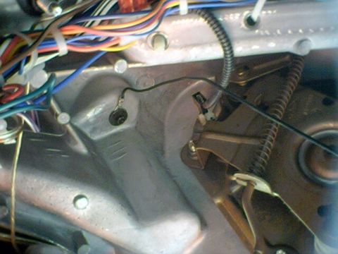1994 Ford Bronco - Close-up view of a vehicle's wiring harness and mechanical linkage, with visible text "SUPERMOTORS.NET" at the bottom right.