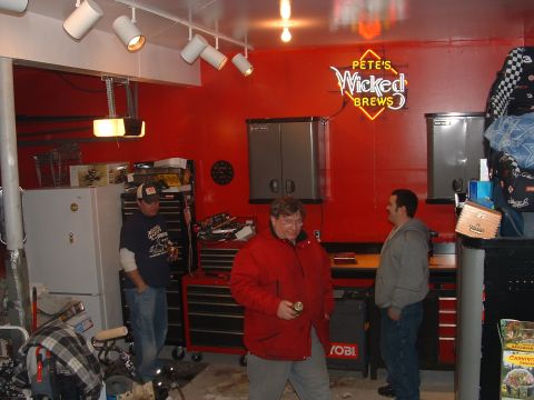 1978 Chevrolet C/K Pickup - A garage scene three men, tool chests, and a neon sign that reads 'Pete's Wicked Brews'.