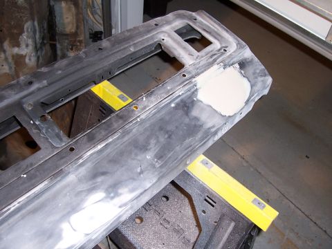 1978 Ford Bronco - A vehicle dashboard section is shown with body filler applied to a damaged area.