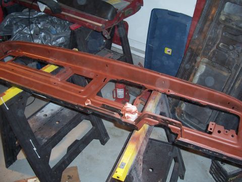 1978 Ford Bronco - Dashboard frame undergoing restoration work, supported by sawhorses in a workshop setting.