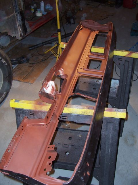 1978 Ford Bronco - A disassembled car dashboard frame is shown, undergoing restoration or repair.