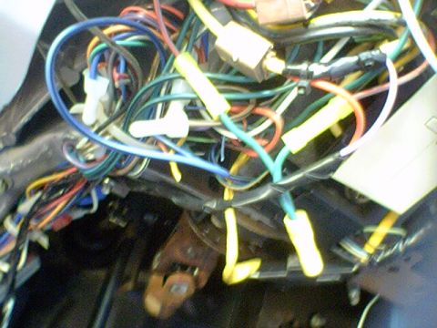 1994 Ford Bronco - A complex web of wires and connectors, likely from a vehicle's interior electrical system, is visible in this close-up shot.