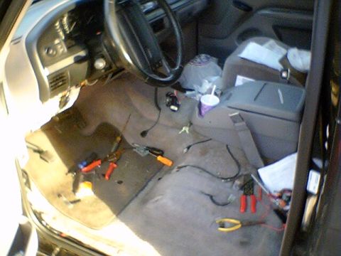1994 Ford Bronco - The interior of a 1994 Ford Bronco shows tools and wiring, suggesting recent work or modifications.