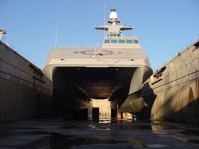 Military catamaran in dry dock, viewed from the front