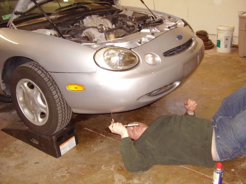 1997 Ford Taurus - Working on the engine of a 1997 Ford Taurus.