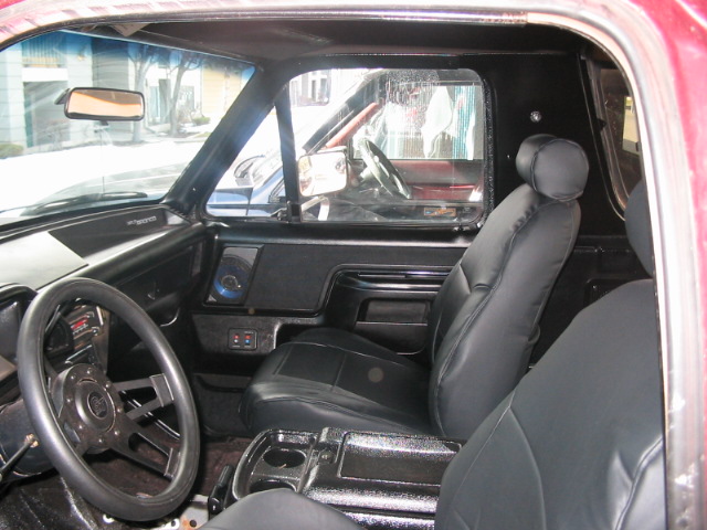1991 Ford Bronco interior showing front seats, dashboard, and steering wheel