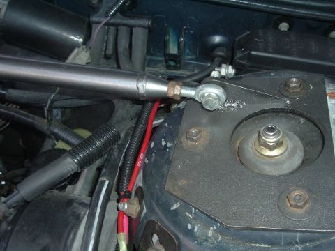 1993 Ford Taurus - Aftermarket strut tower brace installed in the engine bay.