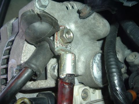 1993 Ford Taurus - Corroded electrical terminal on a vehicle alternator, showing wear and tear.