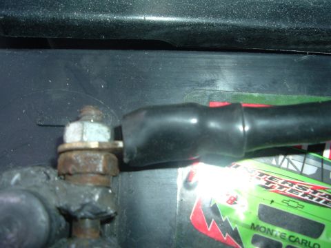 1993 Ford Taurus - Close-up of a corroded battery terminal and cable connection.