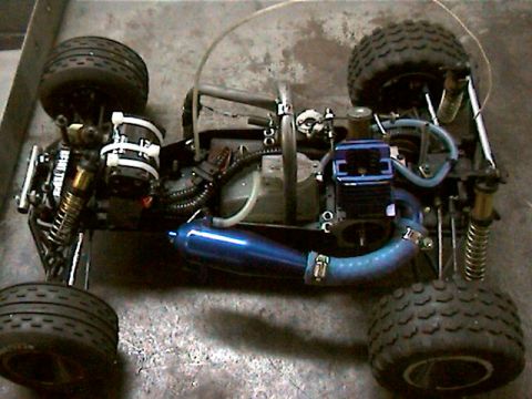 1977 Ford F-150 - This is a remote control car with a nitro engine and a blue exhaust pipe.