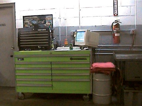 1977 Ford F-150 - A garage scene features a green rolling tool chest, a black Craftsman toolbox, and a desktop computer setup.