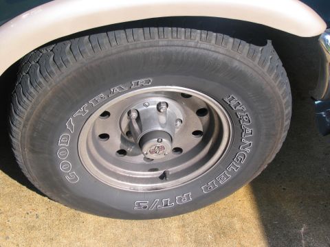 1995 Ford C-150 (Centurion Conversions) - Close-up of a Goodyear Wrangler RT/S tire and wheel assembly.