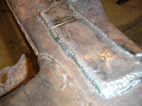 1967 Ford Bronco - This image shows a close-up of a rusty metal frame with extensive welding, not a 1967 Ford Bronco.