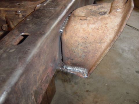 1967 Ford Bronco - Rusty frame section with new welds, likely part of a vehicle restoration project.
