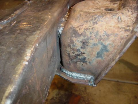 1967 Ford Bronco - The photo shows two rusty metal frame sections that have been welded together.