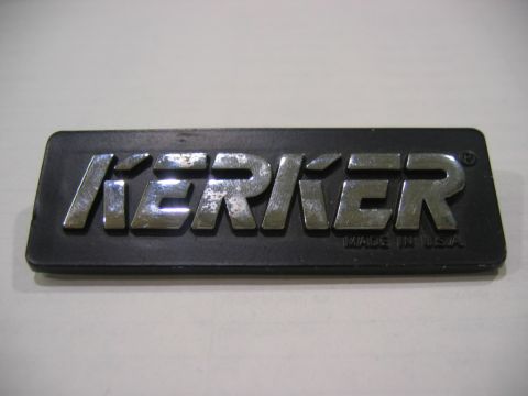 1985 Ford LTD Crown Victoria - This is a close-up of a black Kerker badge with chrome lettering that says "Kerker" and "Made in USA".