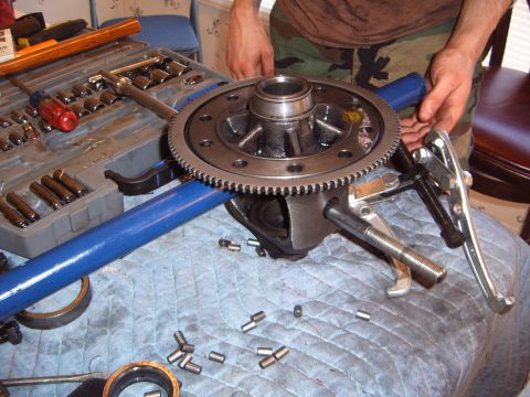 1988 Ford Bronco - Differential gear assembly and tools laid out on a blue shop towel for repair.