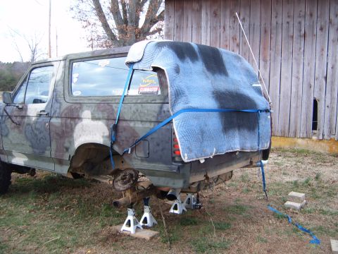 1988 Ford Bronco - This Ford Bronco, possibly from the late 1980s, is undergoing maintenance with its rear axle removed.