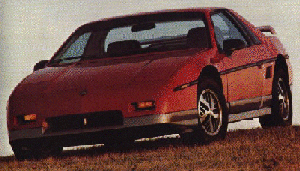 1991 Ford Bronco - A red Pontiac Fiero is shown from a 3/4 front angle against a muted background.