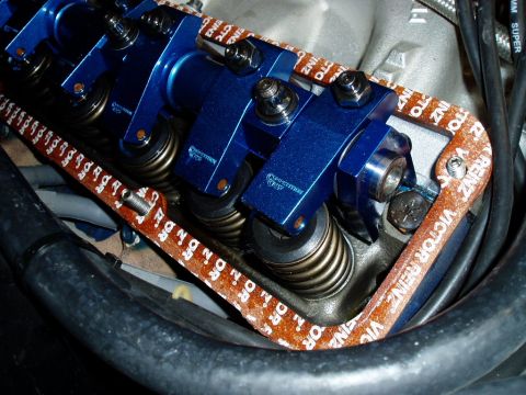 1966 Ford Fairlane - Close-up view of an engine's valve train, blue aluminum valve covers and springs, with a Victor Reinz gasket visible.