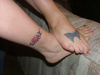 1985 Ford Bronco - Close-up of tattoos on a person's lower leg and foot, a heart and a butterfly design.
