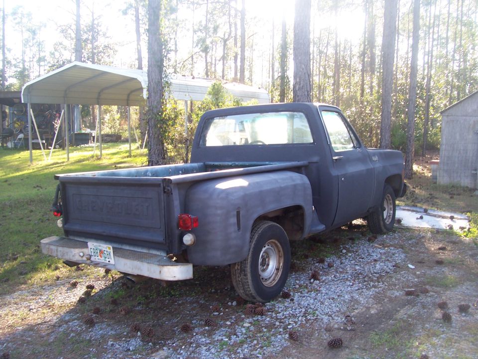 Dark blue 1974 Chevrolet C/K Pickup truck, rear 3/4 view