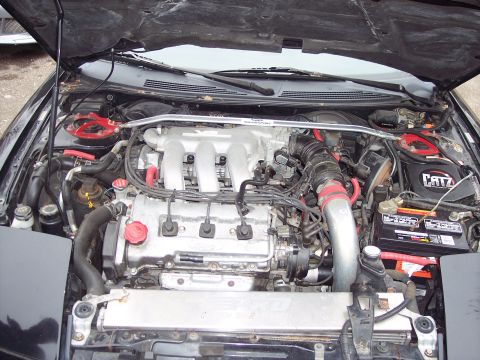 1995 Ford Probe - Engine bay view of a V6 engine, a CATZ air filter and a strut bar.