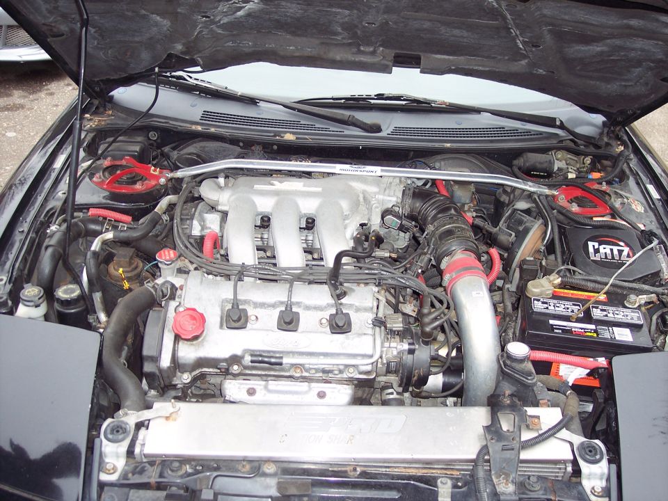 Engine bay with V6 engine, CATZ air filter, and strut bar