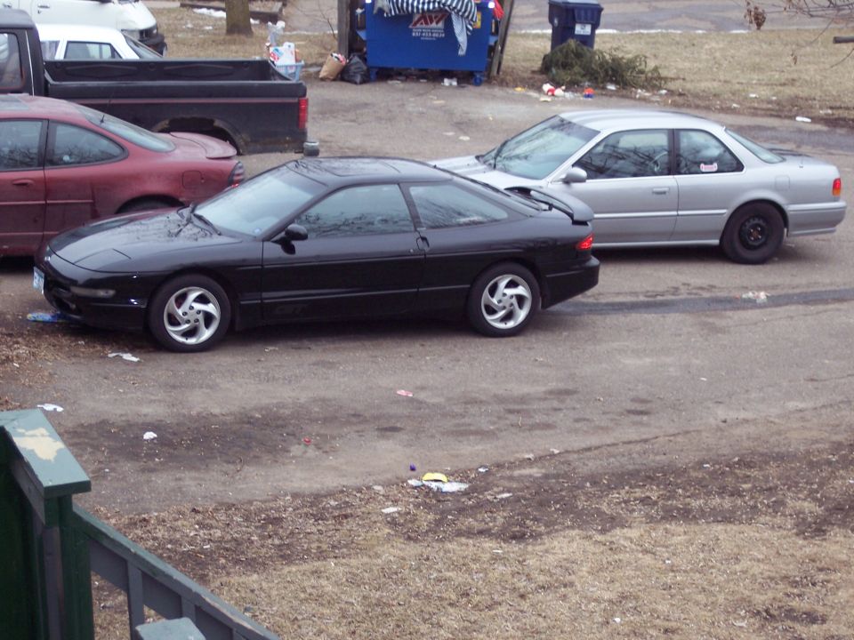 Black 1995 Ford Probe GT coupe, side view