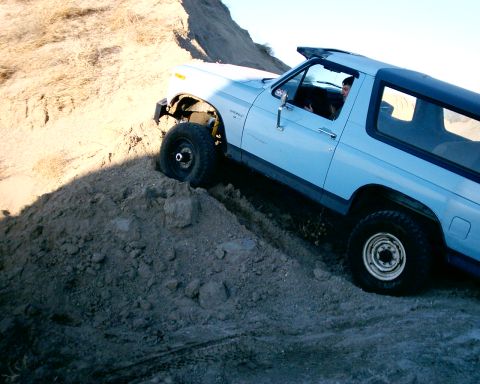 1985 Ford Bronco - Even with bald skinny front tires she wants to climb. The detroit in the 14-bolt rear just digs in!