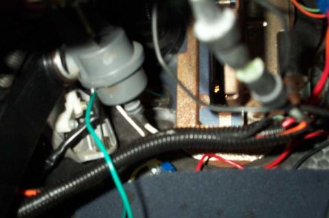 1998 Ford Crown Victoria - The green wire is the tach wire, running through a grommet into the firewall. It's blurry but you get the idea.