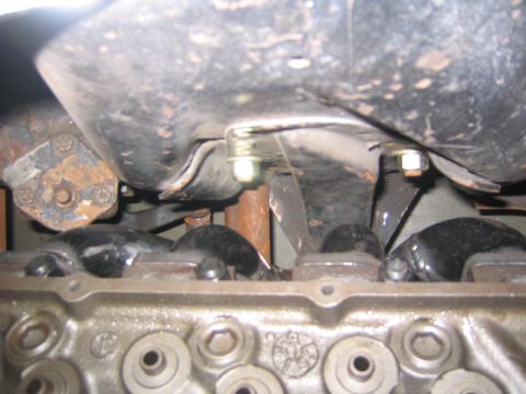 1969 Ford Mustang - Underside view of an engine, showing the block and oil pan assembly with visible bolts and mounting hardware.