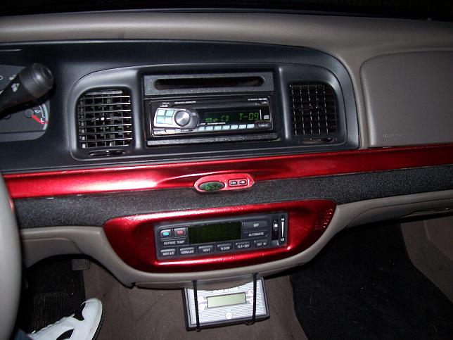 Interior dashboard with red trim and aftermarket stereo