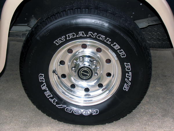 Close-up of a Goodyear Wrangler RT/S tire on a chrome wheel