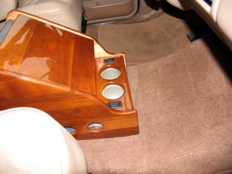 1995 Ford C-150 (Centurion Conversions) - Custom wood console with cup holders is visible in the interior of the vehicle.